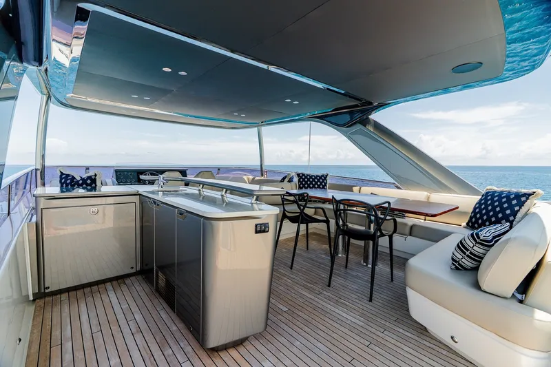 Slide: The Image of Luxurious 2022 Princess Y78 yacht deck with seating, dining area, and ocean view. - 32