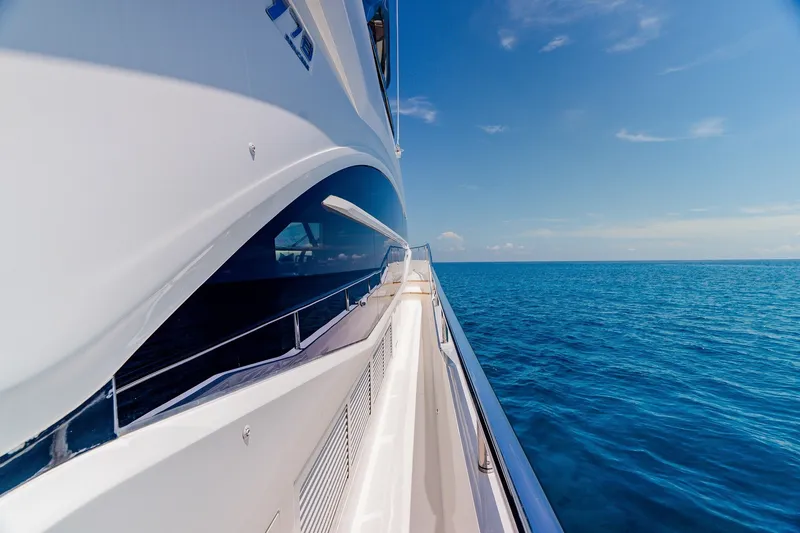 Slide: The Image of Side view of 2022 Princess Y78 yacht cruising on open blue sea. - 35