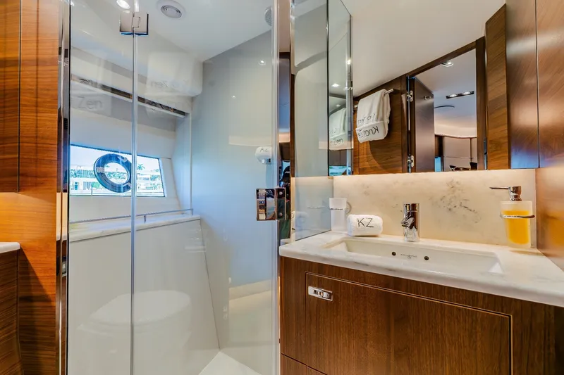 Slide: The Image of Luxurious bathroom interior on 2022 Princess Y78 yacht, featuring elegant wood and marble finishes. - 24