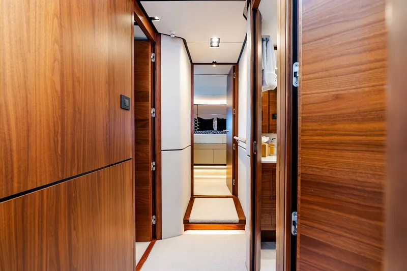 Slide: The Image of Luxurious interior hallway of 2022 Princess Y78 yacht with wooden finishes. - 25