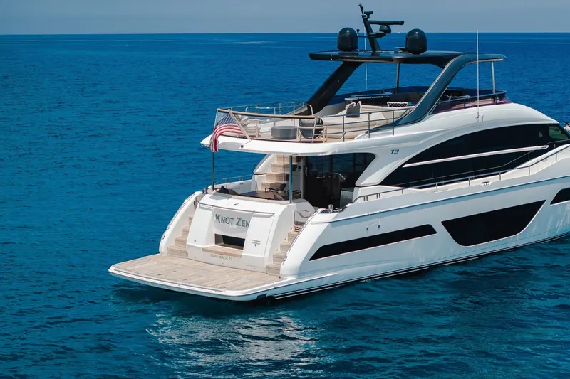 Slide: The Image of Luxurious 2022 Princess Y78 yacht cruising on clear blue ocean waters. - 40