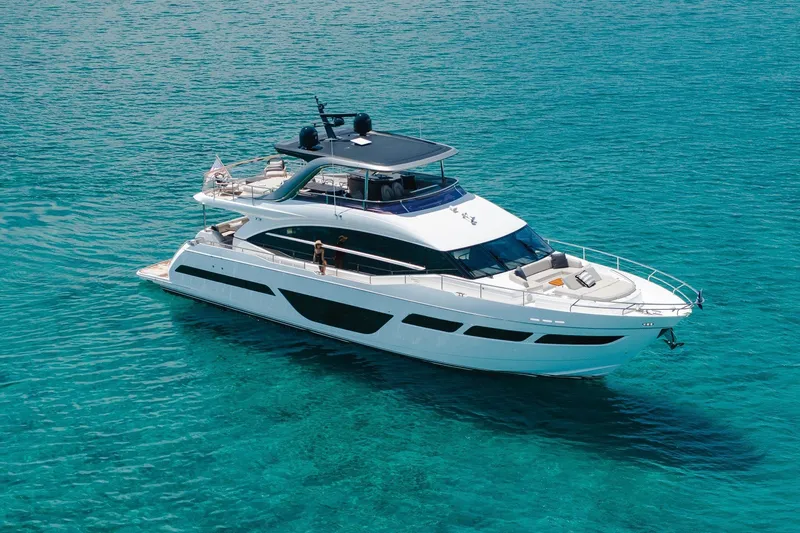 Slide: The Image of Luxurious 2022 Princess Y78 yacht cruising on clear turquoise waters. - 29