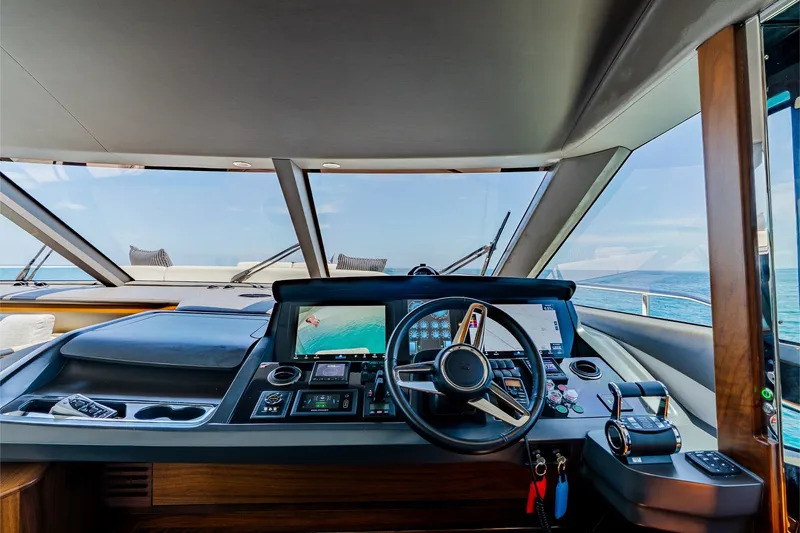 Slide: The Image of Luxurious 2022 Princess Y78 yacht cockpit with advanced navigation controls and ocean view. - 17