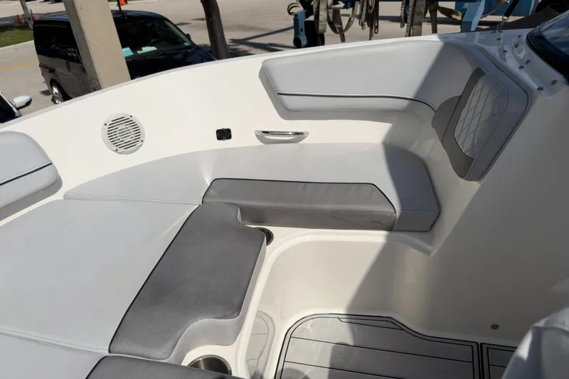 Slide: The Image of 2023 Bayliner VR5 Bowrider OB interior seating with gray cushions and speaker. - 19