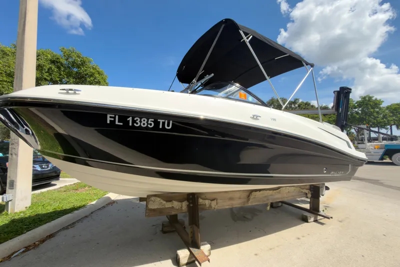 The Image of 2023 Bayliner VR5 Bowrider OB on display, featuring sleek black and white design. - 1