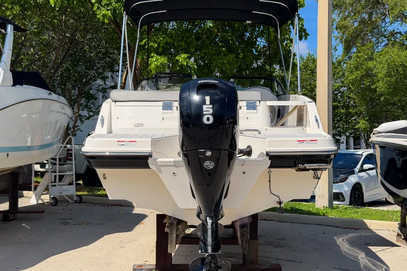 Slide: The Image of 2023 Bayliner VR5 Bowrider OB with 150 HP engine, displayed outdoors. - 27