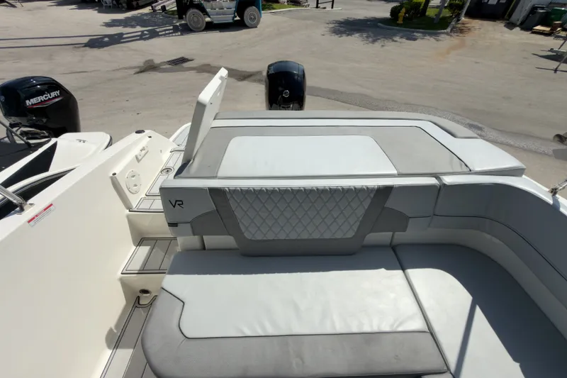 Slide: The Image of 2023 Bayliner VR5 Bowrider OB boat interior with cushioned seating and sleek design. - 24
