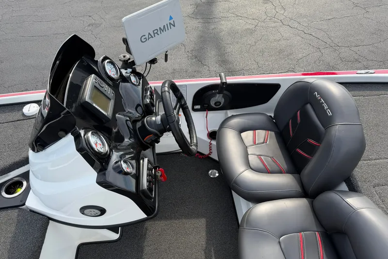 Slide: The Image of Interior of a 2016 Nitro Z18 boat with Garmin navigation system and dual seats. - 14