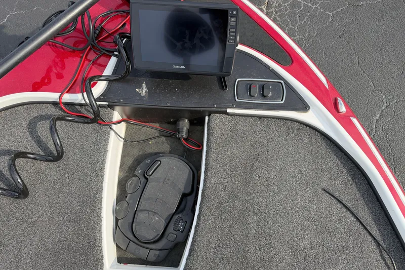 Slide: The Image of 2016 Nitro Z18 boat dashboard with Garmin display and foot pedal controls. - 7
