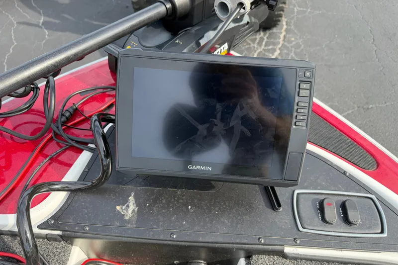 Slide: The Image of Garmin device on 2016 Nitro Z18 boat dashboard with cables and controls. - 6