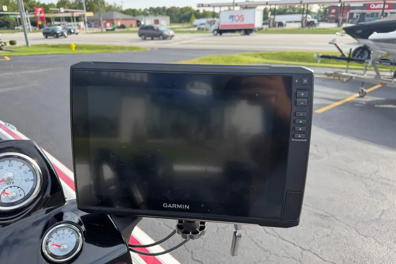 Slide: The Image of Garmin GPS device on a 2016 Nitro Z18 boat dashboard, with speedometer visible. - 13