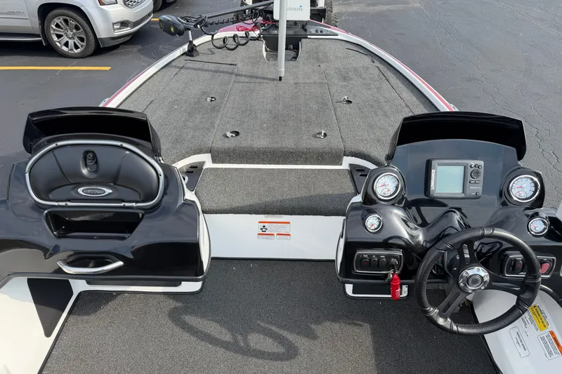Slide: The Image of Interior view of a 2016 Nitro Z18 boat with steering wheel and dashboard controls. - 3