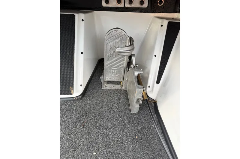 Slide: The Image of Foot pedal mechanism in a 2016 Nitro Z18 boat interior. - 15