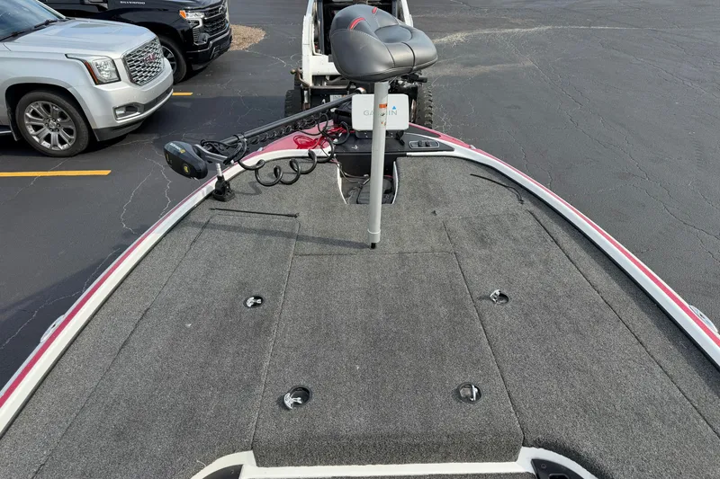 Slide: The Image of 2016 Nitro Z18 boat deck with trolling motor and seat in parking lot. - 5
