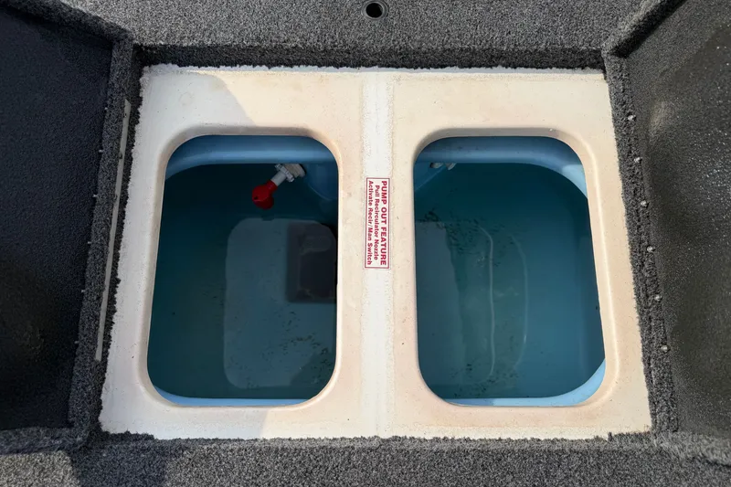 Slide: The Image of Livewell compartments in a 2016 Nitro Z18 boat, filled with water. - 17