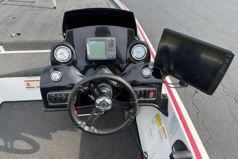Slide: The Image of Steering console of 2016 Nitro Z18 boat with gauges and navigation screens. - 11
