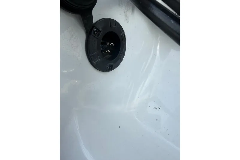 Slide: The Image of Close-up of a 2016 Nitro Z18 boat plug socket on a white surface. - 9