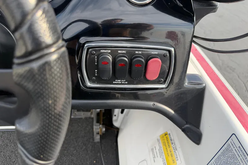 Slide: The Image of Control panel of a 2016 Nitro Z18 boat with switches for aerator, bilge, and horn. - 16