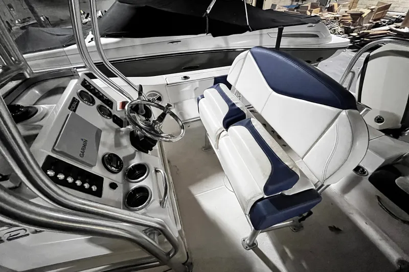 Slide: The Image of 2020 Robalo R200 Center Console boat interior with steering wheel and seating. - 14