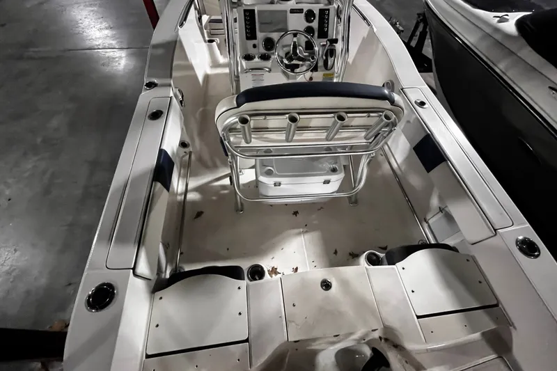 Slide: The Image of 2020 Robalo R200 Center Console boat interior with seating and control panel. - 20