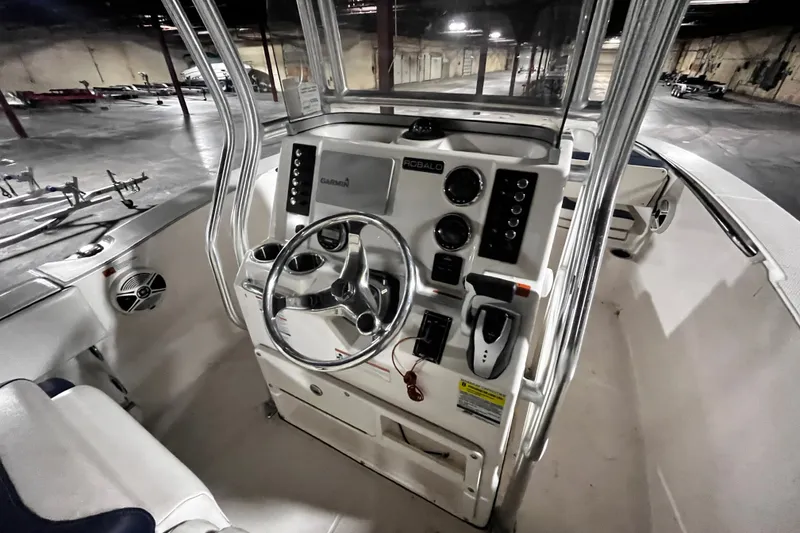 Slide: The Image of 2020 Robalo R200 Center Console boat interior with steering wheel and controls. - 10