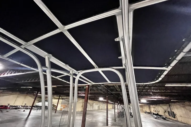 Slide: The Image of 2020 Robalo R200 Center Console boat frame in a warehouse setting. - 11