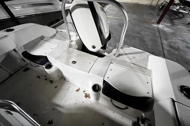 Slide: The Image of 2020 Robalo R200 Center Console boat interior with seating and storage compartments. - 17