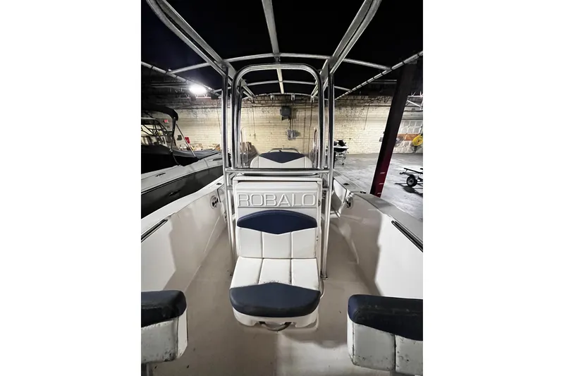 Slide: The Image of 2020 Robalo R200 Center Console boat interior with seating and console view. - 6