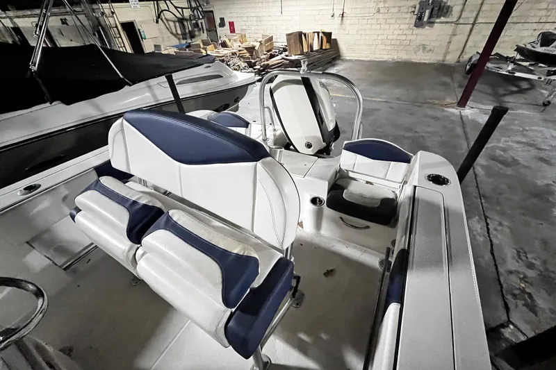 Slide: The Image of 2020 Robalo R200 Center Console boat interior with blue and white seating. - 15