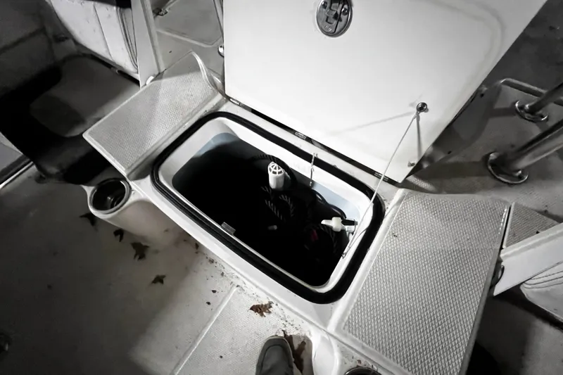 Slide: The Image of Open storage compartment on 2020 Robalo R200 Center Console boat deck. - 16