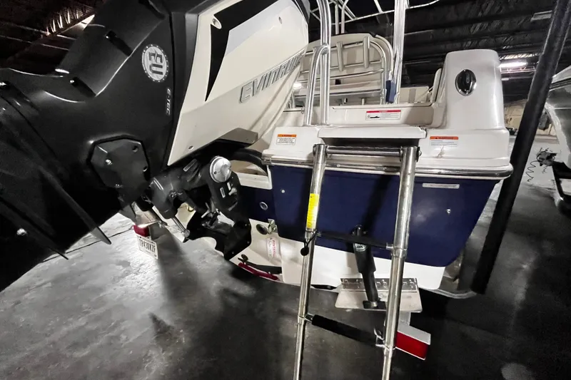 Slide: The Image of 2020 Robalo R200 Center Console boat with Evinrude engine and rear ladder. - 22