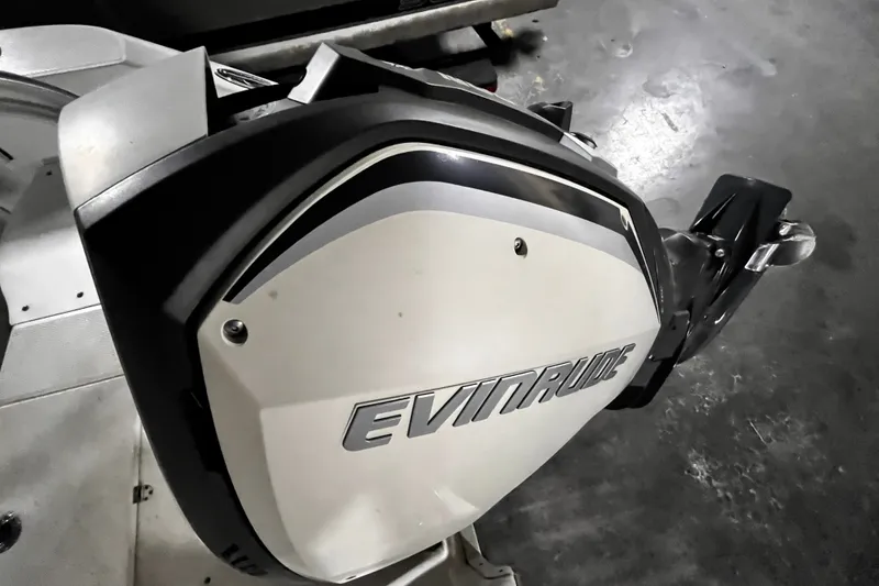 Slide: The Image of Evinrude outboard motor on a 2020 Robalo R200 Center Console boat. - 18