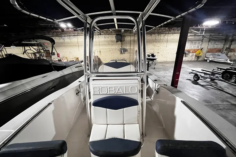 Slide: The Image of 2020 Robalo R200 Center Console boat in indoor storage facility. - 7