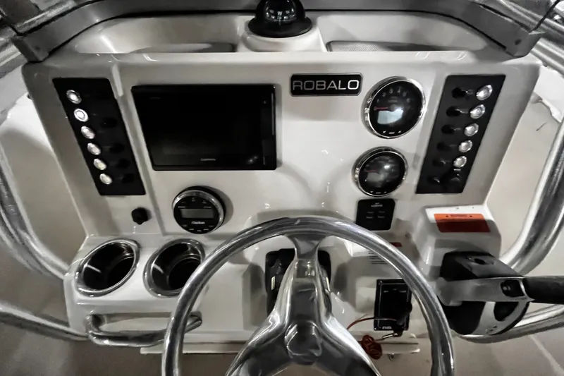 Slide: The Image of 2020 Robalo R200 Center Console dashboard with steering wheel and control panel. - 12