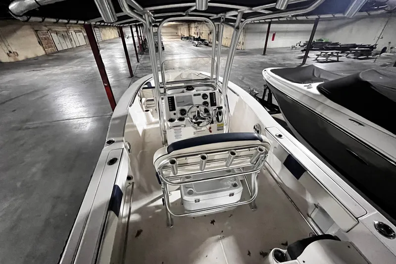 Slide: The Image of 2020 Robalo R200 Center Console boat in indoor storage facility. - 19