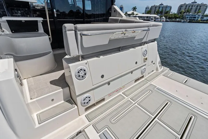Slide: The Image of The 2018 Sea Ray Fly 460 features a spacious aft platform with seating and speakers. - 24