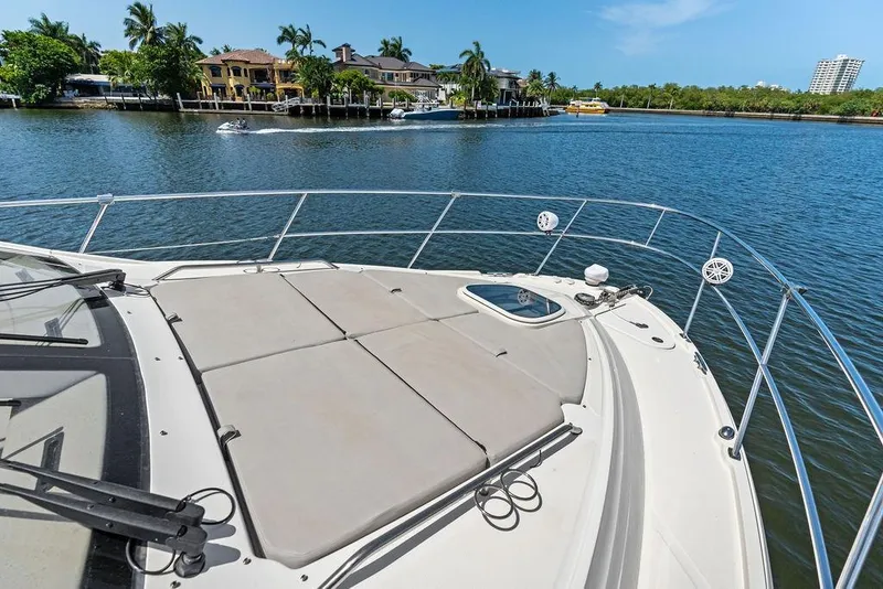Slide: The Image of The deck of a 2018 Sea Ray Fly 460 overlooking calm waters. - 34