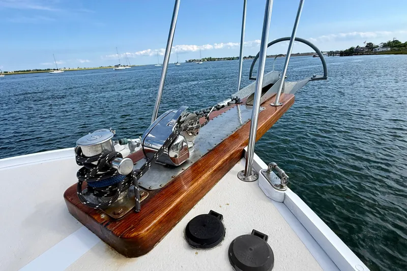 Slide: The Image of 1987 Wilbur Flybridge Cruiser anchor system on calm waters. - 25