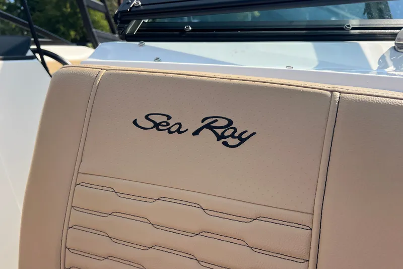 Slide: The Image of 2022 Sea Ray SPX 210 boat seat with logo, beige upholstery. - 25