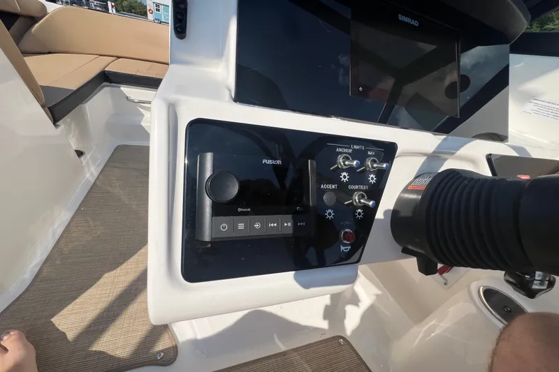 Slide: The Image of Control panel of a 2022 Sea Ray SPX 210 boat with navigation and audio controls. - 42