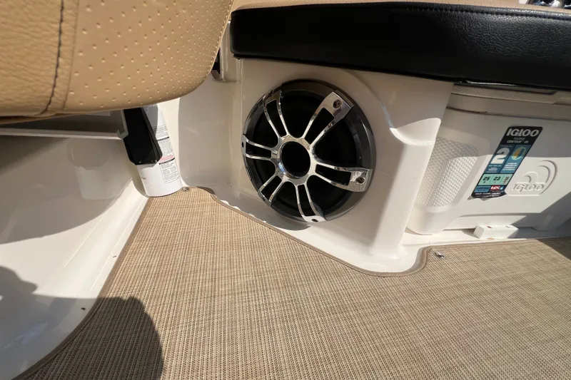 Slide: The Image of 2022 Sea Ray SPX 210 boat interior with speaker and Igloo cooler. - 29