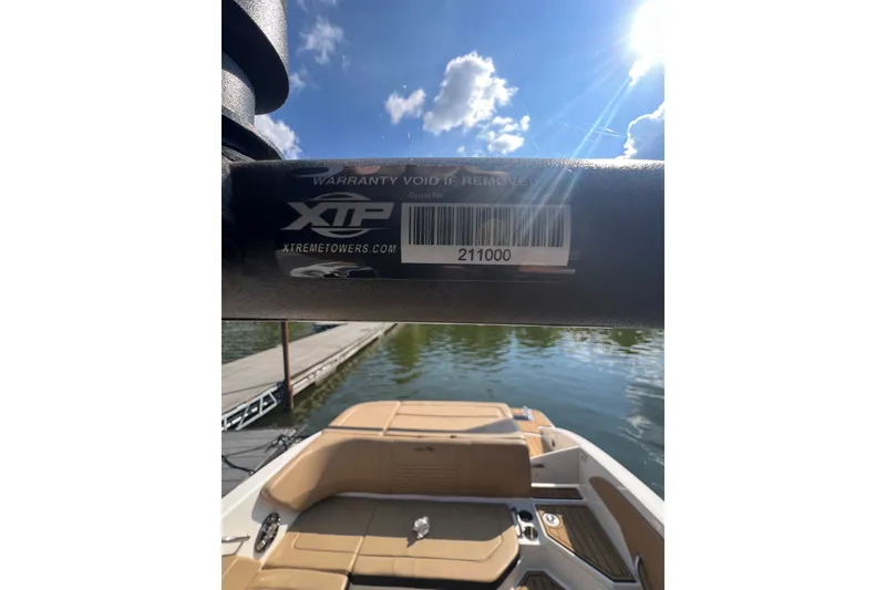 Slide: The Image of 2022 Sea Ray SPX 210 boat with XTP tower, docked on a sunny day. - 32