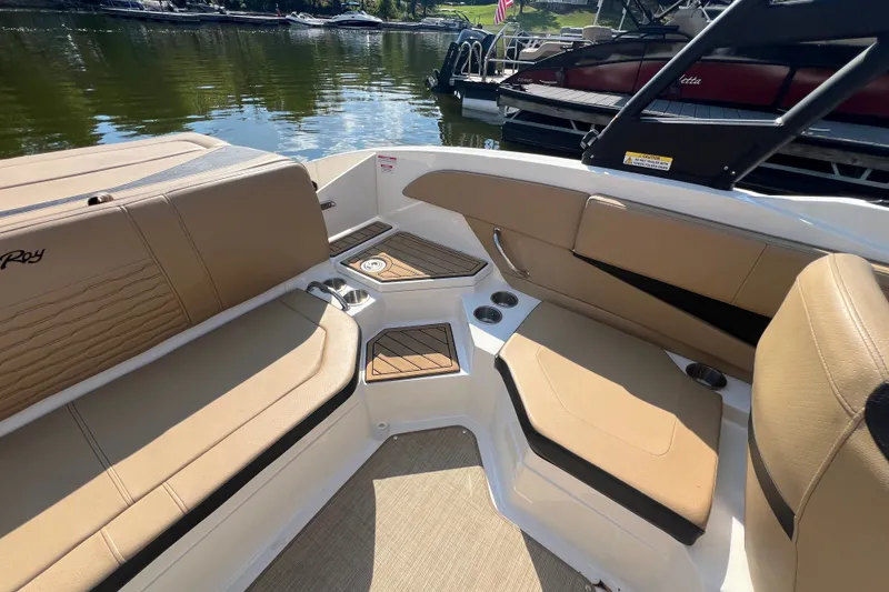 Slide: The Image of Interior of 2022 Sea Ray SPX 210 boat with tan seating and cup holders. - 30