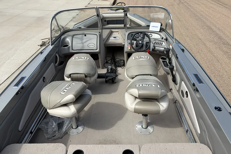 Slide: The Image of 2003 Lund 1850 Tyee OB boat interior with steering console and seating. - 3