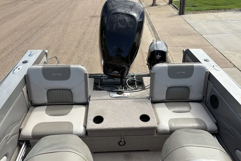 Slide: The Image of 2003 Lund 1850 Tyee OB boat interior with seating and outboard motor. - 6