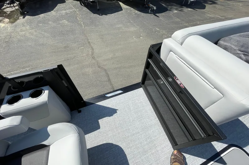 Slide: The Image of Interior view of 2026 Harris Cruiser 230 SLDH boat with seating and cup holders. - 15