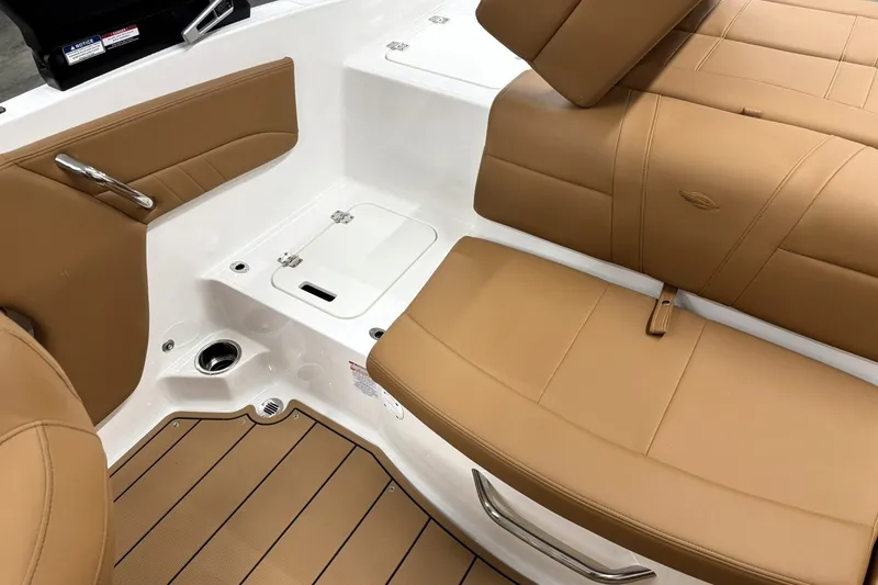 Slide: The Image of 2027 Chaparral 21 SSi boat interior with tan leather seating and white accents. - 19