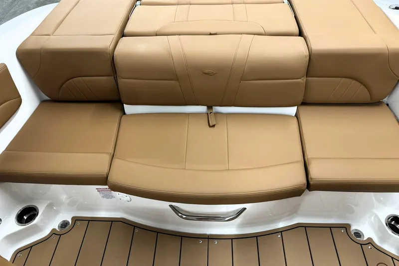 Slide: The Image of 2027 Chaparral 21 SSi boat with tan leather seating and sleek design. - 18