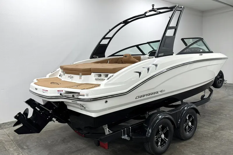 Slide: The Image of 2027 Chaparral 21 SSi boat on trailer, sleek design, white exterior, modern features. - 3