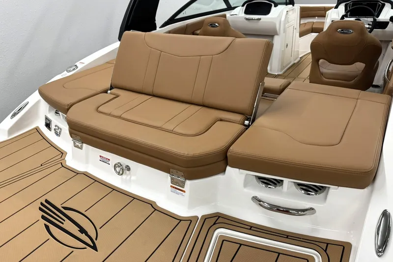 Slide: The Image of 2027 Chaparral 21 SSi boat interior with tan leather seating and sleek design. - 6